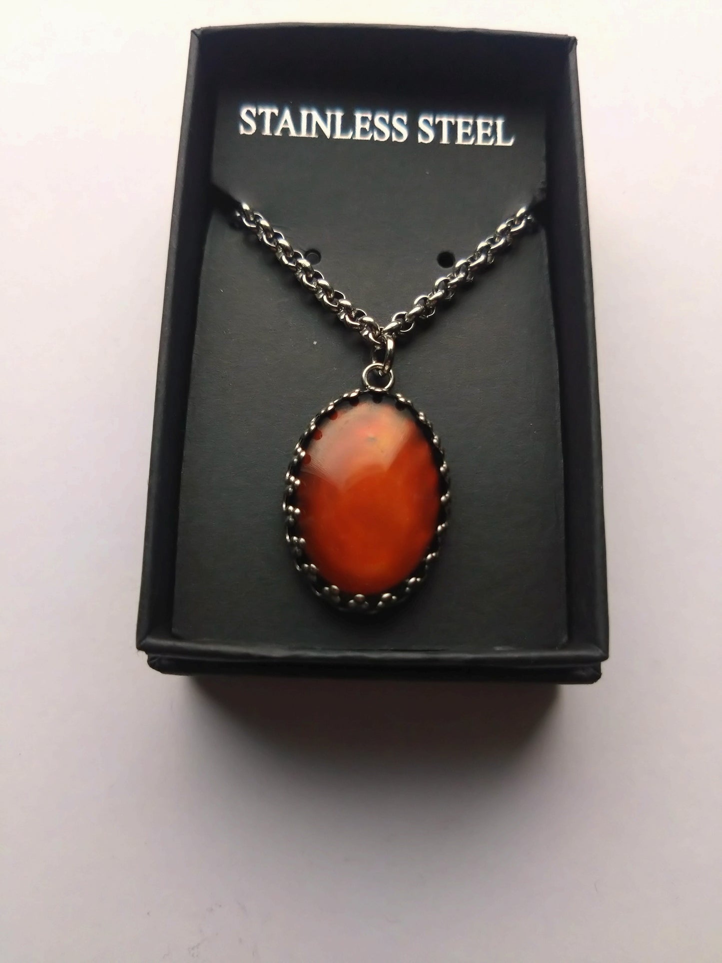 Colour change cabochon necklace on a 18 inch stainless steel chain