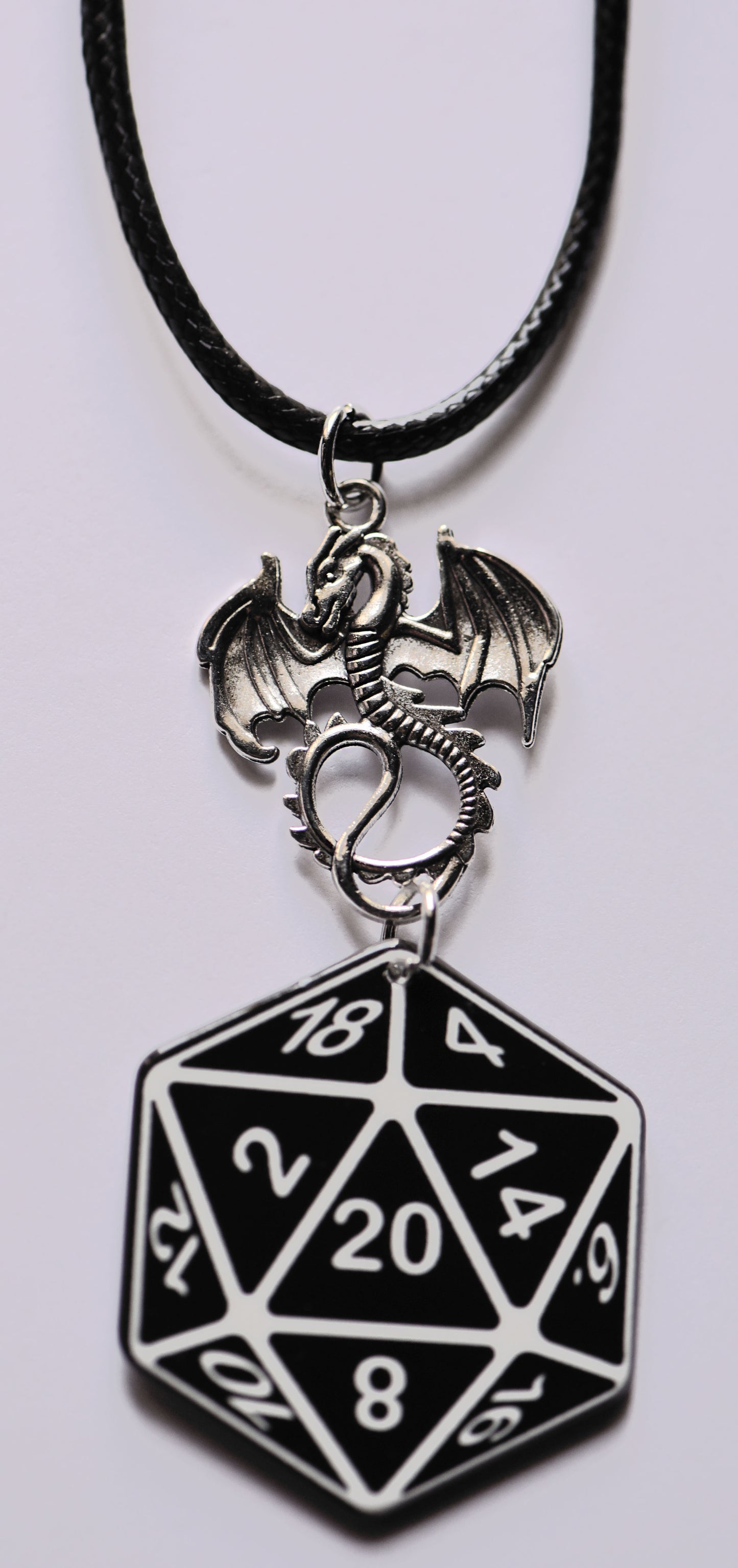 Large dice and dragom necklace on a 18 inch black cord