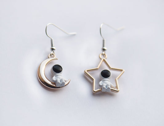 Cute astronaut earrings on star and moon charms