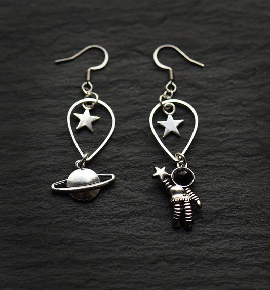 Astronaut and planet charm earrings