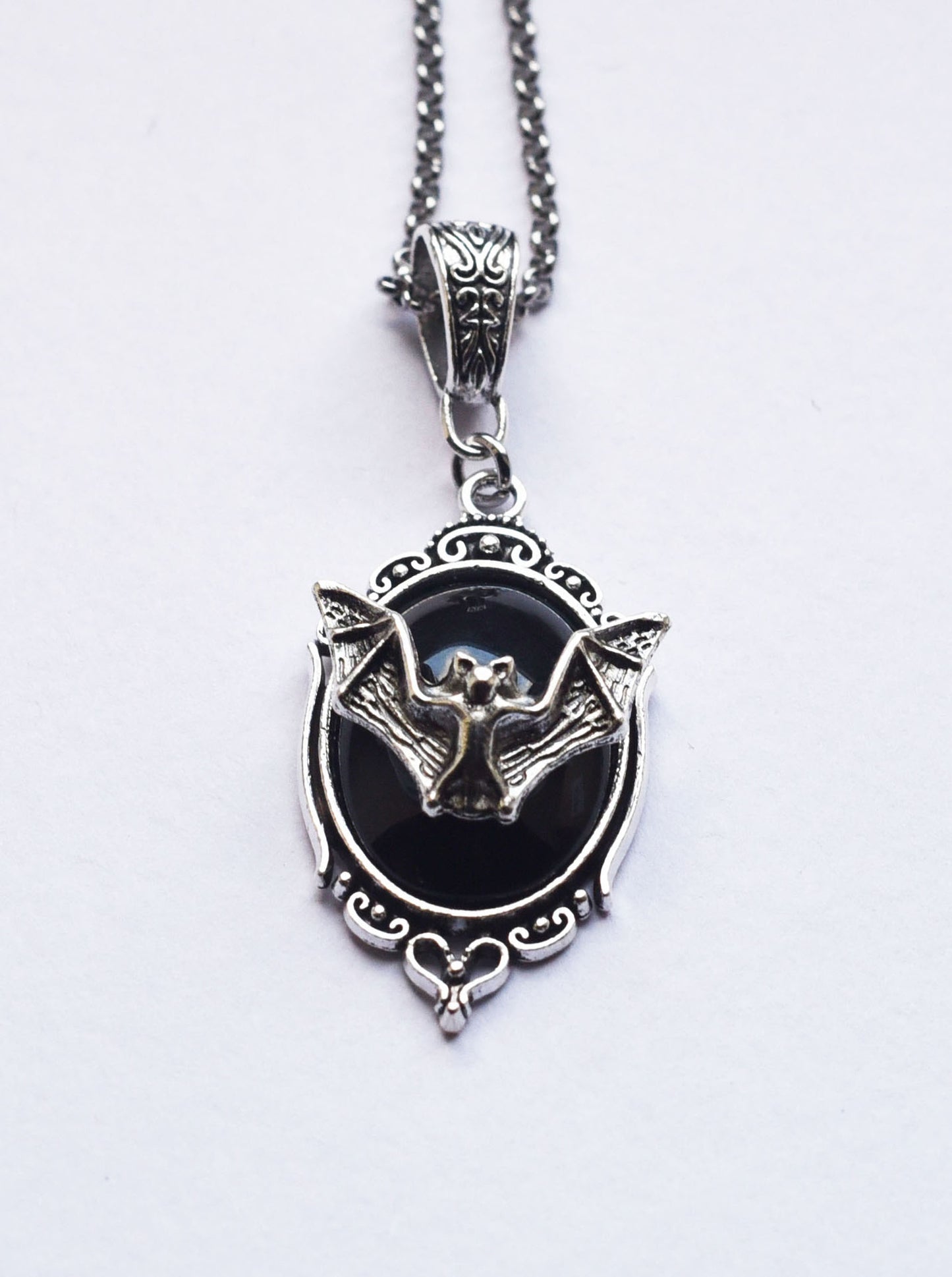Black cabochon bat necklace with an 18 inch stainless steel chain