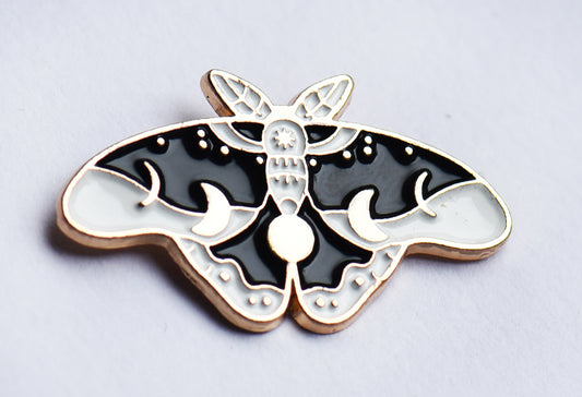 Black, white and gold moth enamel pin badge