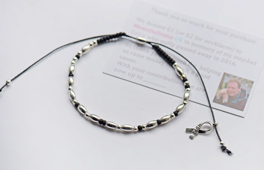 Morse code bracelet 'fuck cancer' with black beads and cancer ribbon charm