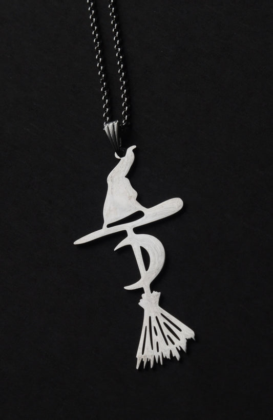 Stainless steel witch and brromstick necklace on a 18 inch chain