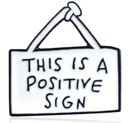 This is a positive sign enamel pin badge