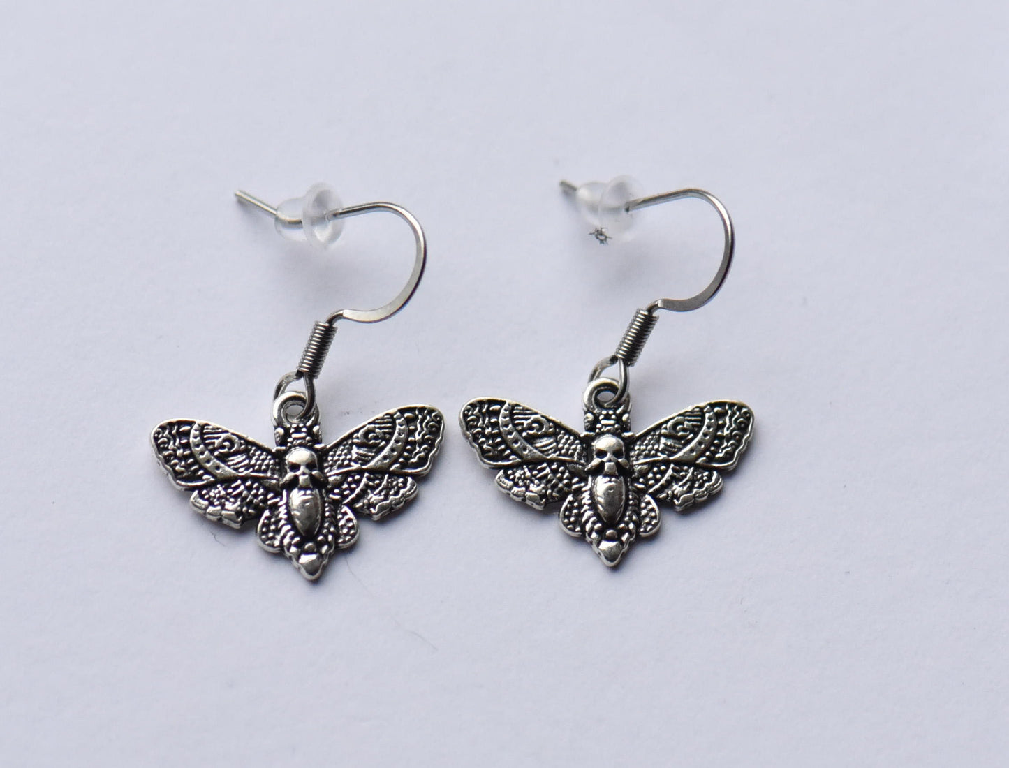 Small moth earrings on stainless steel ear wires