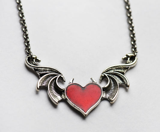 Gothic winged red heart necklace on a 18 inch stainless steel chain