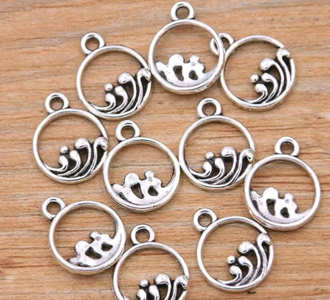 Small silver coloured wave charms 10pk