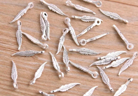 Tiny feather charms 10pk