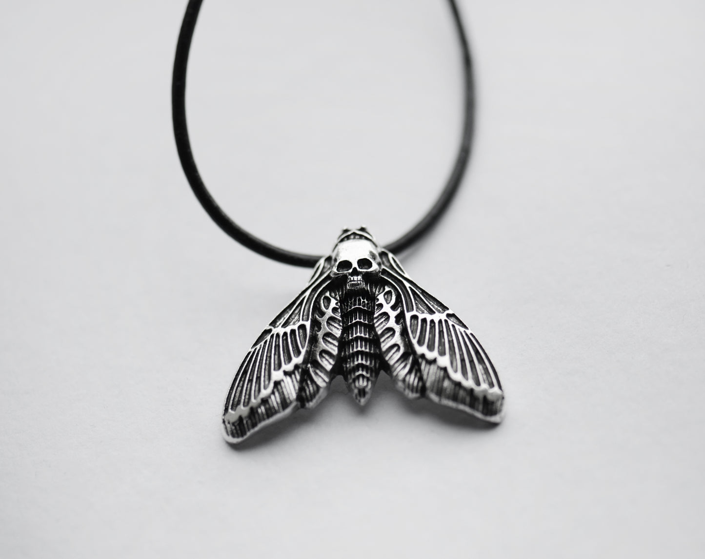 Deathshead hawk moth necklace on a black cord