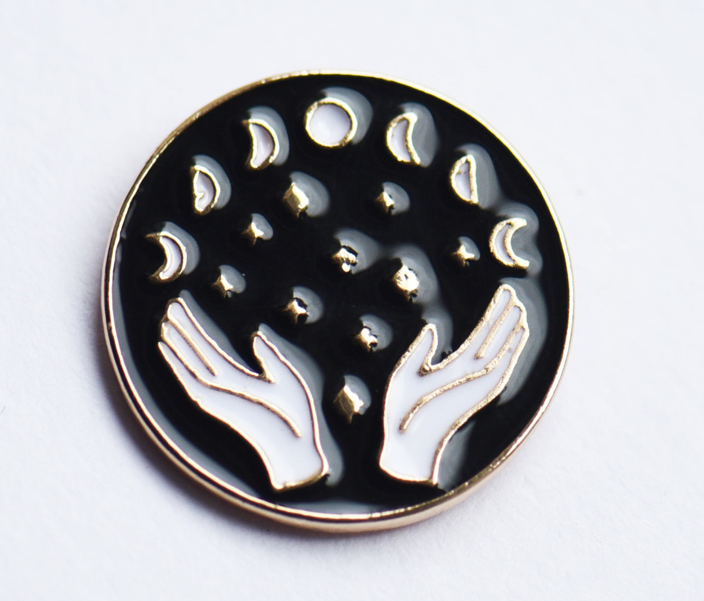 Hand and moon lunar phase enamel pin badge